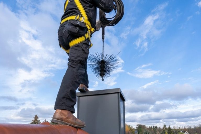 Stock image of a chimney sweep in action.