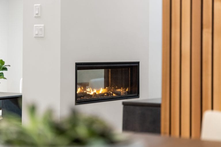 Stock image of a modern fireplace that could benefit from a Level 2 chimney inspection.